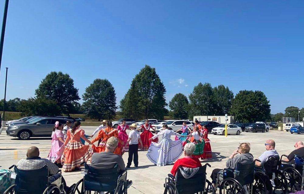 Dance troupe performing for residents at a local senior living facility
