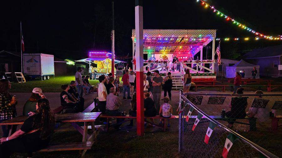 The main stage lit up in colorful lights in the evening