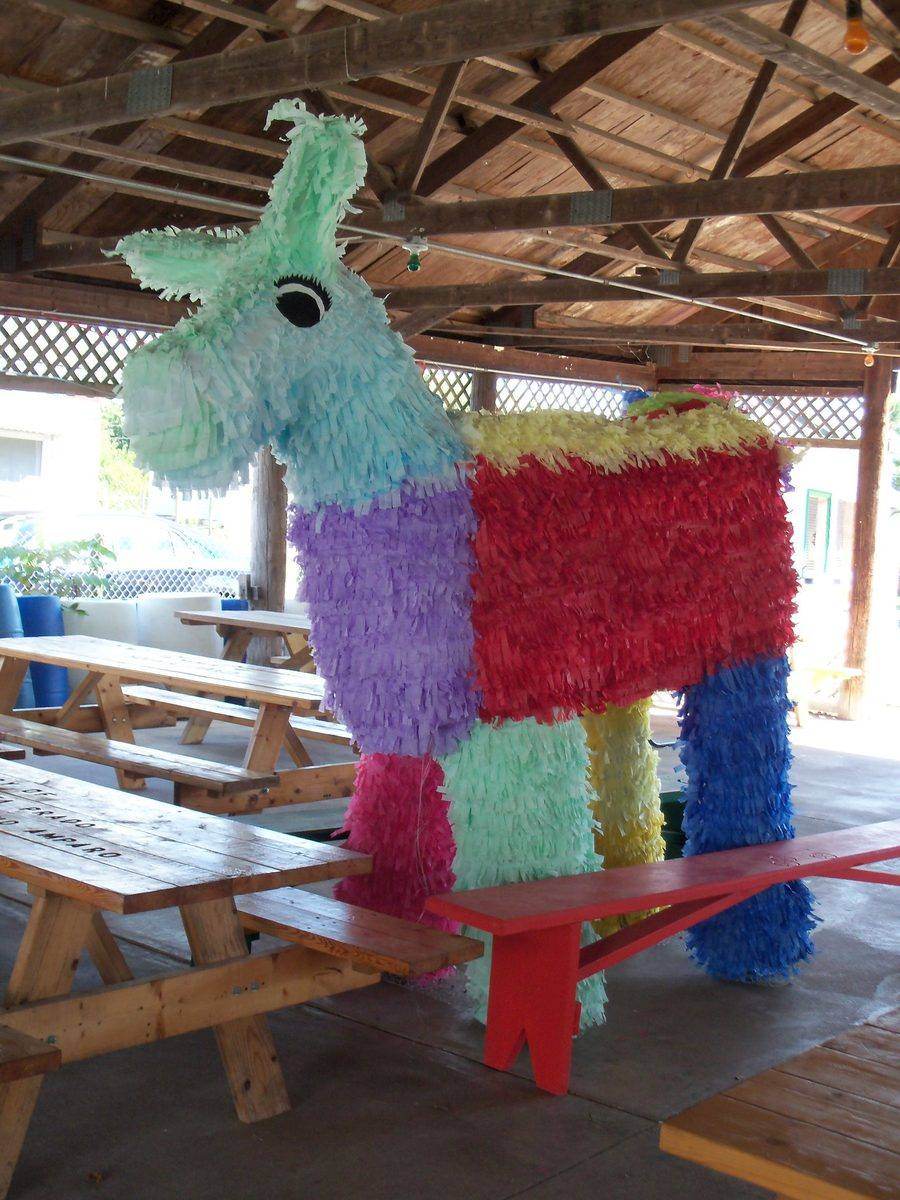 A large decorative donkey piñata at the Hospitality Tent