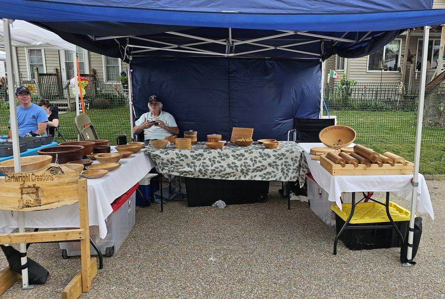 Cartwright Creations, a vendor booth selling handmade wooden bowls