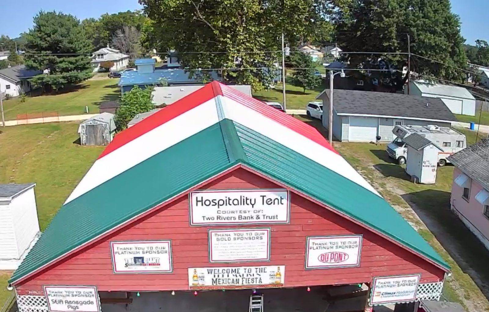 Aerial view of the Fiesta Hospitality Tent, its roof painted in the colors of the Mexican flag
