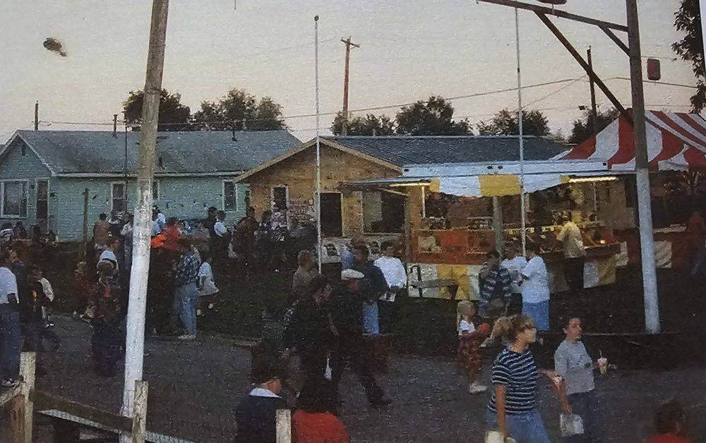 Archival photo of the Fiesta carnival grounds at dusk