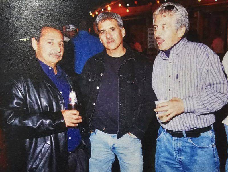 Archival photo of friends at a Fiesta evening event