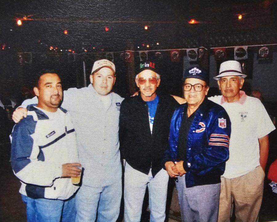 Archival photo of five men at a Fiesta gathering