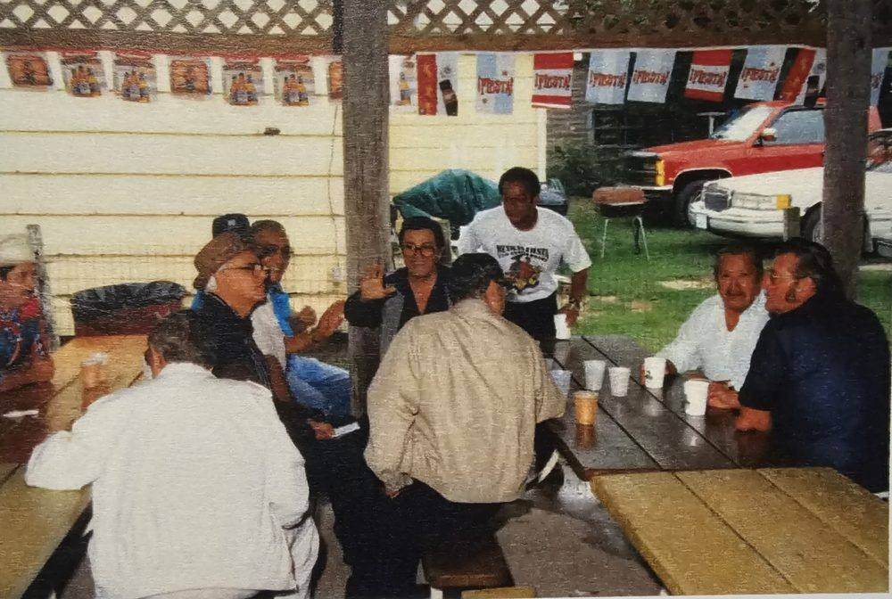 Archival photo of a gathering at the Hospitality Tent